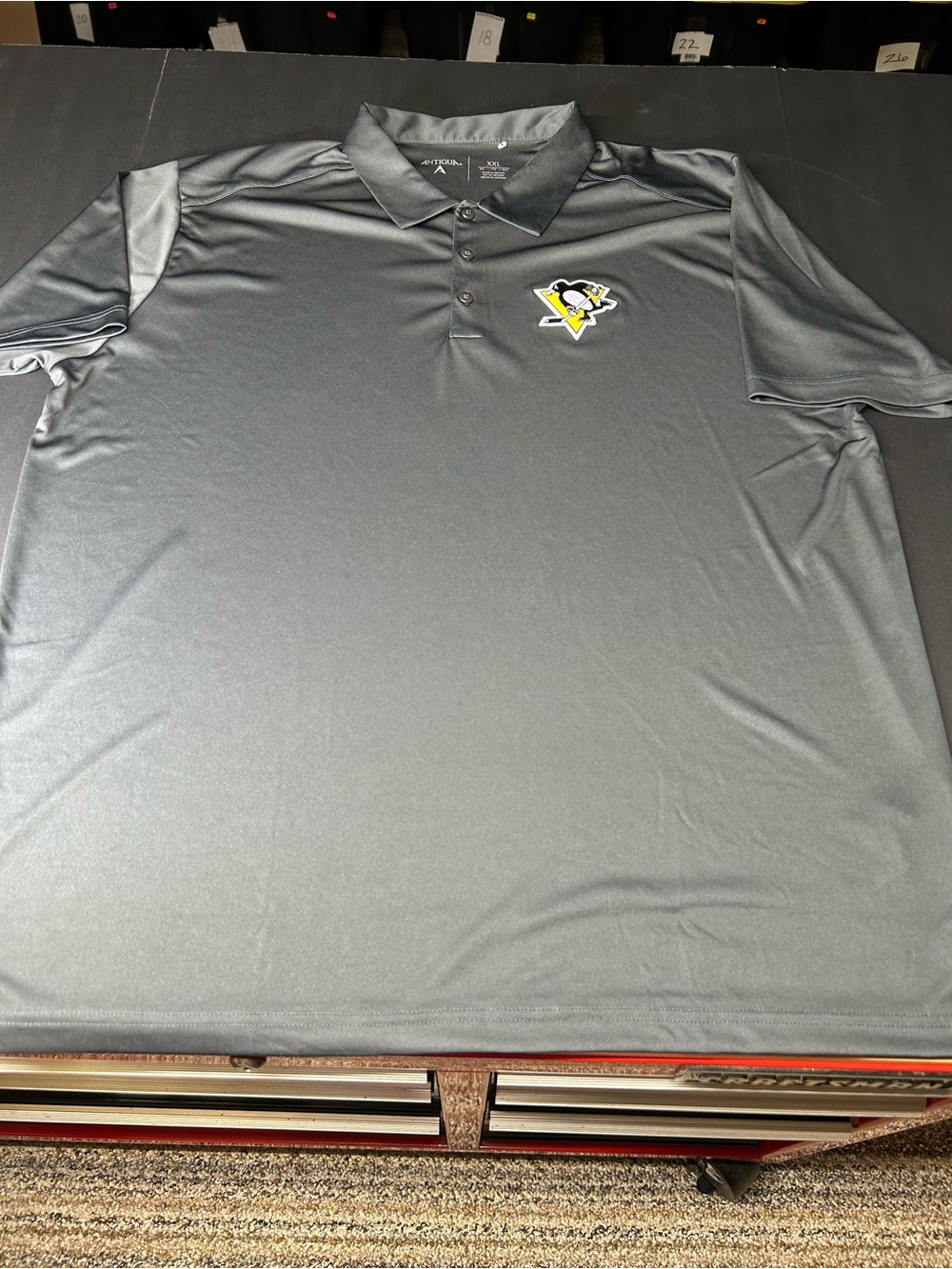 Antigua Gray Polo with Pittsburgh Penguins Embroidered Logo